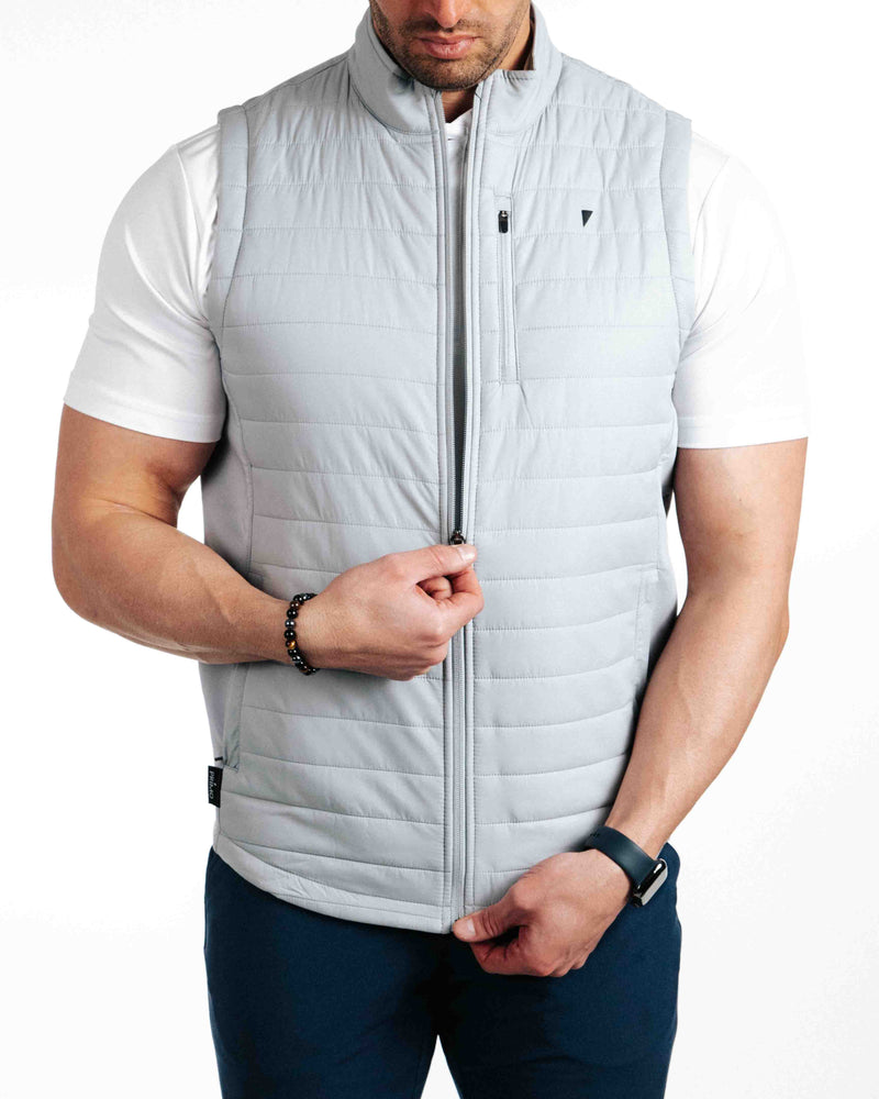 The Primo Golf Light Gray Vest zipping down