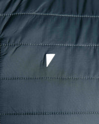 The Primo Golf Dark Gray Vest logo